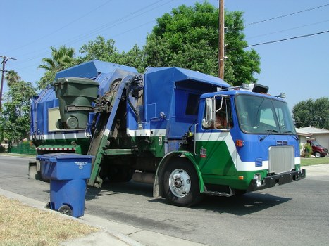 Professional waste disposal team handling construction materials