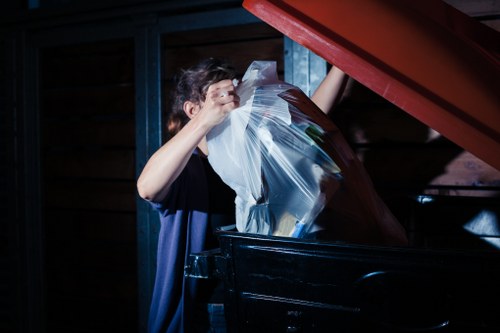 Personnel sorting recyclable materials during muck away services