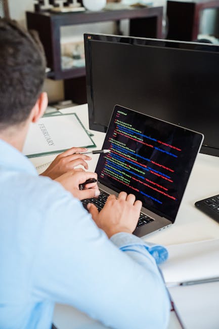 A close-up image of a computer screen displaying lines of colorful programming code, including keywords, variables, and functions related to web development, with text appearing in various colors such